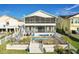 Backyard features a screened lanai, brick pool deck, outdoor seating, and waterfront views at 6311 Bayside Dr, New Port Richey, FL 34652