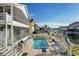 A refreshing pool with brick patio, waterfront views, and outdoor seating at 6311 Bayside Dr, New Port Richey, FL 34652