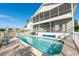 Backyard pool features brick patio, screened lanai, and white aluminum fencing at 6311 Bayside Dr, New Port Richey, FL 34652