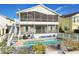 Backyard features a screened lanai, pool, brick pool deck, and lush landscaping at 6311 Bayside Dr, New Port Richey, FL 34652