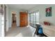 Bright sitting area with a desk, large window and doorway to another space at 6311 Bayside Dr, New Port Richey, FL 34652