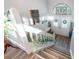 Charming staircase leads to foyer with decorative accents and glass-paneled doors at 6311 Bayside Dr, New Port Richey, FL 34652