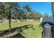 A grassy backyard with a tree at 6827 Citrus Creek Ln, Tampa, FL 33625