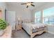Inviting bedroom featuring a queen-sized bed, soft lighting, and ample closet space for comfortable living at 6827 Citrus Creek Ln, Tampa, FL 33625
