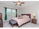 Serene bedroom featuring a comfortable bed, soft colors, and natural light for a restful retreat at 6827 Citrus Creek Ln, Tampa, FL 33625