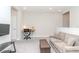 Upstairs loft featuring a sofa, desk, and TV area at 6827 Citrus Creek Ln, Tampa, FL 33625