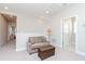 Upstairs loft featuring a sofa and ottoman at 6827 Citrus Creek Ln, Tampa, FL 33625