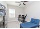 Office space with natural light, a desk, and a futon for guests at 6827 Citrus Creek Ln, Tampa, FL 33625