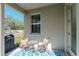 Cozy covered patio seating area, perfect for relaxation, with a table, chairs, and a decorative rug at 6827 Citrus Creek Ln, Tampa, FL 33625