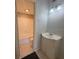 Functional bathroom with a single vanity, toilet, and a bathtub with white tile surround at 7506 Presley Pl # 108, Tampa, FL 33617