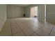Spacious living room featuring tile floors and a sliding glass door that opens to a balcony at 7506 Presley Pl # 108, Tampa, FL 33617