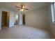 Open living space with tile flooring, a ceiling fan, and access to other rooms at 7506 Presley Pl # 108, Tampa, FL 33617