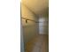 Large walk-in closet with shelving and rod, providing ample storage space at 7506 Presley Pl # 108, Tampa, FL 33617
