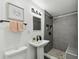 Modern bathroom with new fixtures, a sleek sink, and a glass-enclosed shower at 7520 Orpine N Dr, St Petersburg, FL 33702