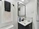 Modern bathroom with basin sink, minimalist design, and marble countertop at 7520 Orpine N Dr, St Petersburg, FL 33702