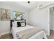 A bedroom with lots of natural light from the windows and minimal décor at 7520 Orpine N Dr, St Petersburg, FL 33702
