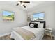 A bedroom with lots of natural light from the windows and minimal décor at 7520 Orpine N Dr, St Petersburg, FL 33702
