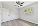 Empty bedroom with built in storage, ceiling fan and bright window light at 7520 Orpine N Dr, St Petersburg, FL 33702