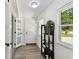 Welcoming entryway with natural light, decorative shelving, clean lines, and easy access to the home at 7520 Orpine N Dr, St Petersburg, FL 33702