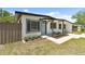Charming single-story home with a well-manicured front yard and a welcoming covered porch at 7520 Orpine N Dr, St Petersburg, FL 33702