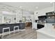 Bright, updated kitchen with new countertops and appliances, with an open floor plan to the living room at 7520 Orpine N Dr, St Petersburg, FL 33702
