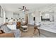 Spacious living room featuring a charming rug, stylish decor, and an open floor plan at 7520 Orpine N Dr, St Petersburg, FL 33702