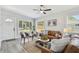 Inviting living room with neutral tones and lots of natural light showcasing the open and airy floor plan at 7520 Orpine N Dr, St Petersburg, FL 33702