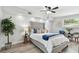 Relaxing main bedroom with a large bed and beautiful décor and accent lighting at 7520 Orpine N Dr, St Petersburg, FL 33702