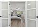Spacious main bedroom showcasing a lovely bed, large windows, and a decorative ceiling fan at 7520 Orpine N Dr, St Petersburg, FL 33702