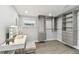 Well-organized walk-in closet with custom shelving, drawers, vanity and ample storage space at 7520 Orpine N Dr, St Petersburg, FL 33702