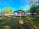 Expansive backyard featuring a cozy home with a convenient carport and ample space at 851 Easy St, Brooksville, FL 34601