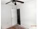 Bedroom featuring a ceiling fan and an open door to a bathroom at 851 Easy St, Brooksville, FL 34601