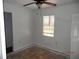 Simple bedroom features a window and a ceiling fan at 851 Easy St, Brooksville, FL 34601