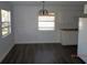 Bright dining area features laminate flooring and an elegant chandelier at 851 Easy St, Brooksville, FL 34601
