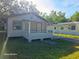 Single-story home with a covered porch, offering curb appeal and outdoor living space at 851 Easy St, Brooksville, FL 34601