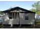 Back side of the single story house, showing two windows at 851 Easy St, Brooksville, FL 34601
