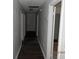 Long hallway with access to several rooms at 851 Easy St, Brooksville, FL 34601