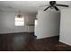 Open-concept living room and kitchen with new flooring and lighting fixtures at 851 Easy St, Brooksville, FL 34601