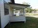 Side porch features a railing, providing a cozy outdoor space at 851 Easy St, Brooksville, FL 34601