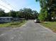 Quiet residential street lined with mature trees and well-maintained homes at 851 Easy St, Brooksville, FL 34601