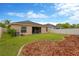Well-maintained backyard with white vinyl fence and landscaping at 8529 Hunters Fork Loop, Ruskin, FL 33573