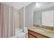The bathroom features a shower/tub and granite countertops at 8529 Hunters Fork Loop, Ruskin, FL 33573