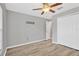 Bedroom with closet, ceiling fan, and wood flooring at 8529 Hunters Fork Loop, Ruskin, FL 33573