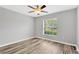 Light and bright bedroom with ceiling fan and wood floors at 8529 Hunters Fork Loop, Ruskin, FL 33573