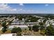An aerial view of condo buildings surrounded by lush greenery and a view of a large body of water at 8555 112Th St # 209, Seminole, FL 33772