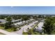 Aerial view of complex featuring lush grounds, parking and mature trees at 8555 112Th St # 209, Seminole, FL 33772
