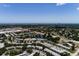 Expansive aerial view of the community near the ocean, showcasing lush greenery and residential buildings at 8555 112Th St # 209, Seminole, FL 33772