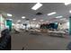 Large meeting room with tables, chairs, and a stage with curtains, suitable for gatherings and events at 8555 112Th St # 209, Seminole, FL 33772