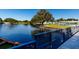 Scenic view of the pond featuring a fountain and the shuffleboard courts in the distance at 8555 112Th St # 209, Seminole, FL 33772