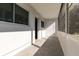 Light and airy screened porch with neutral tile, bright white walls and an exterior door at 8555 112Th St # 209, Seminole, FL 33772